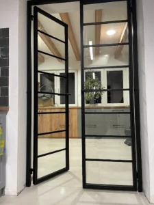 Nowoczesne drzwi loftowe stalowe dwuskrzydłowe z naświetlami – wielkogabarytowa ścianka industrialna ze szkła i stali Loft Steel Tarnów